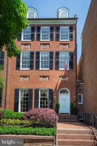 Historic brick townhouse with elegant entrance.