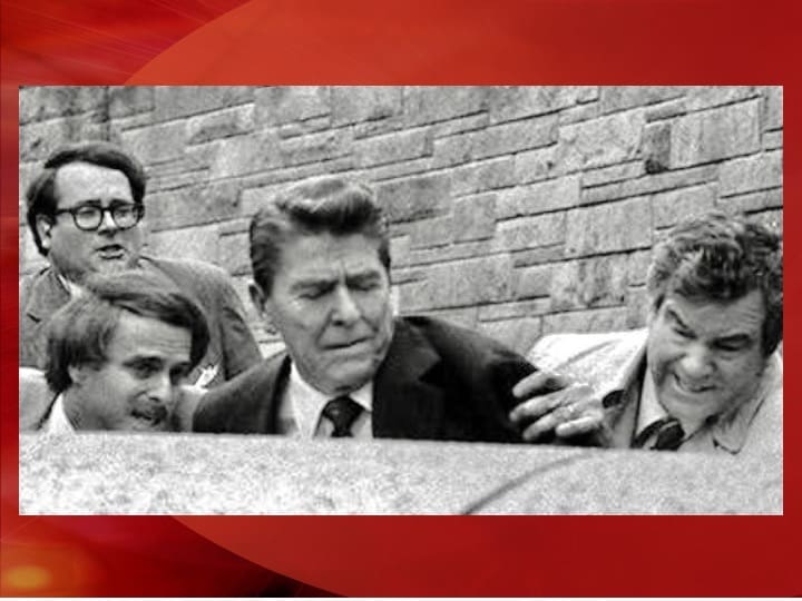 People reacting in distress during an event.