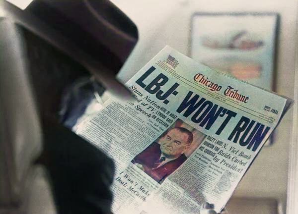 Man reading newspaper headline: "LBJ: Won't Run.