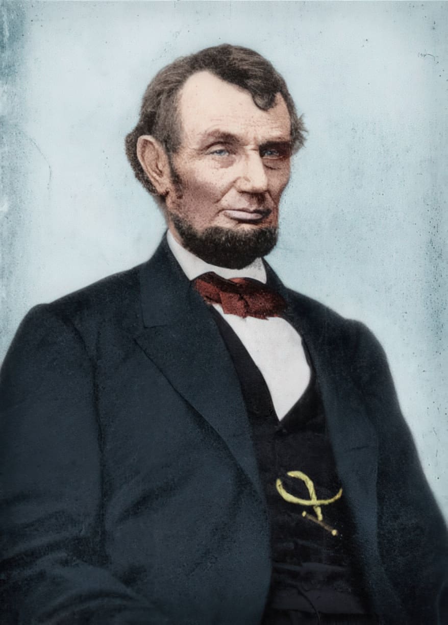 Man with beard in formal attire portrait.