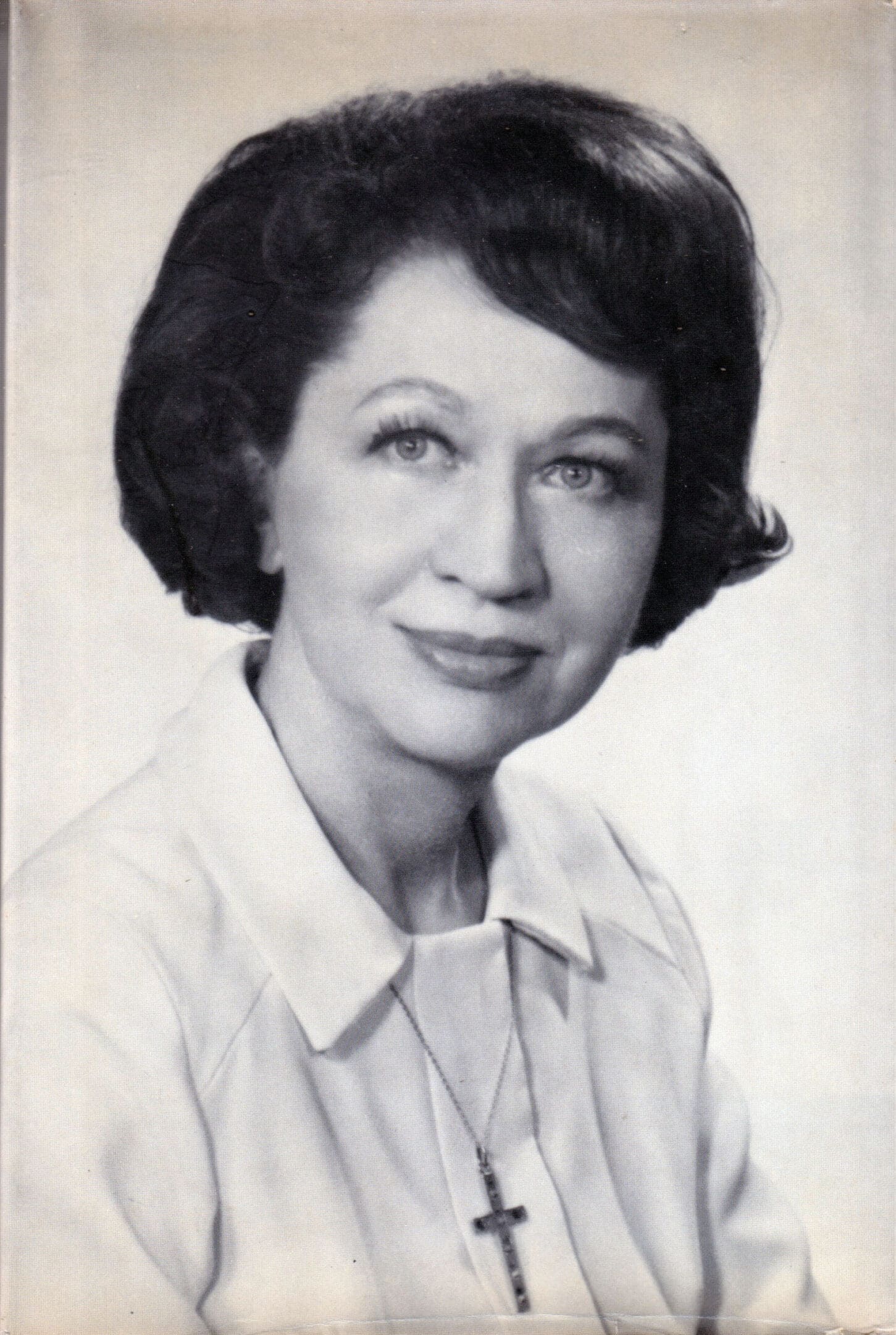 Portrait of a woman with short hair.
